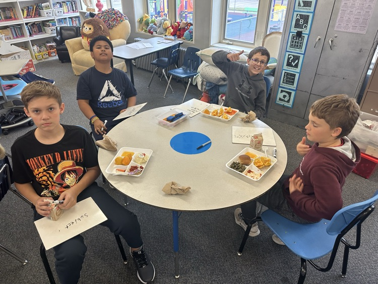 kids eating and writing