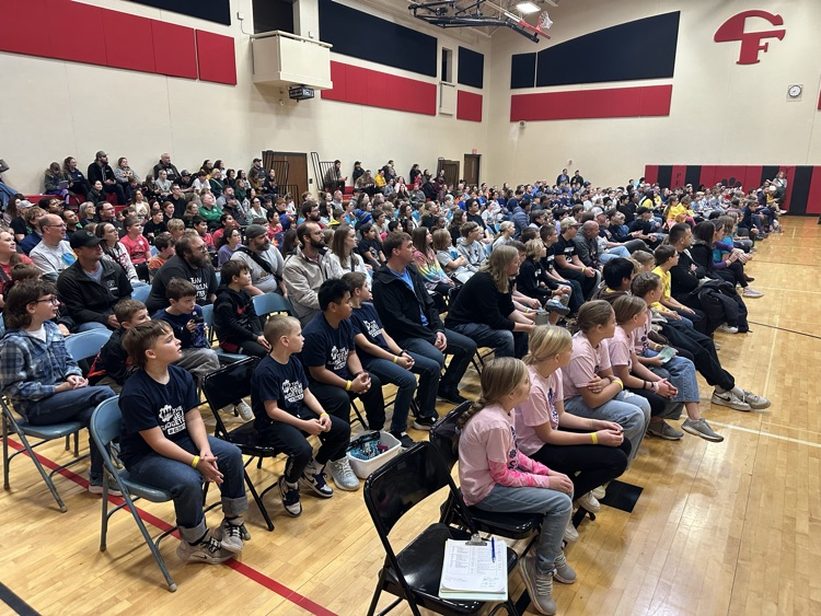 group of students watching robotics