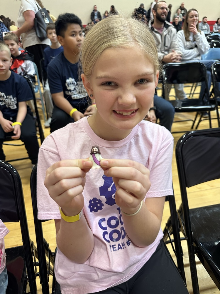 smiling girls with award