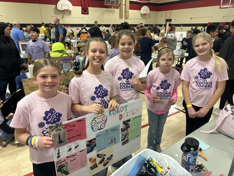 group of kids with sign 