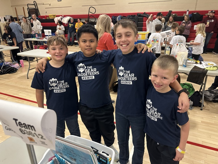 group of boys with hands around each other 