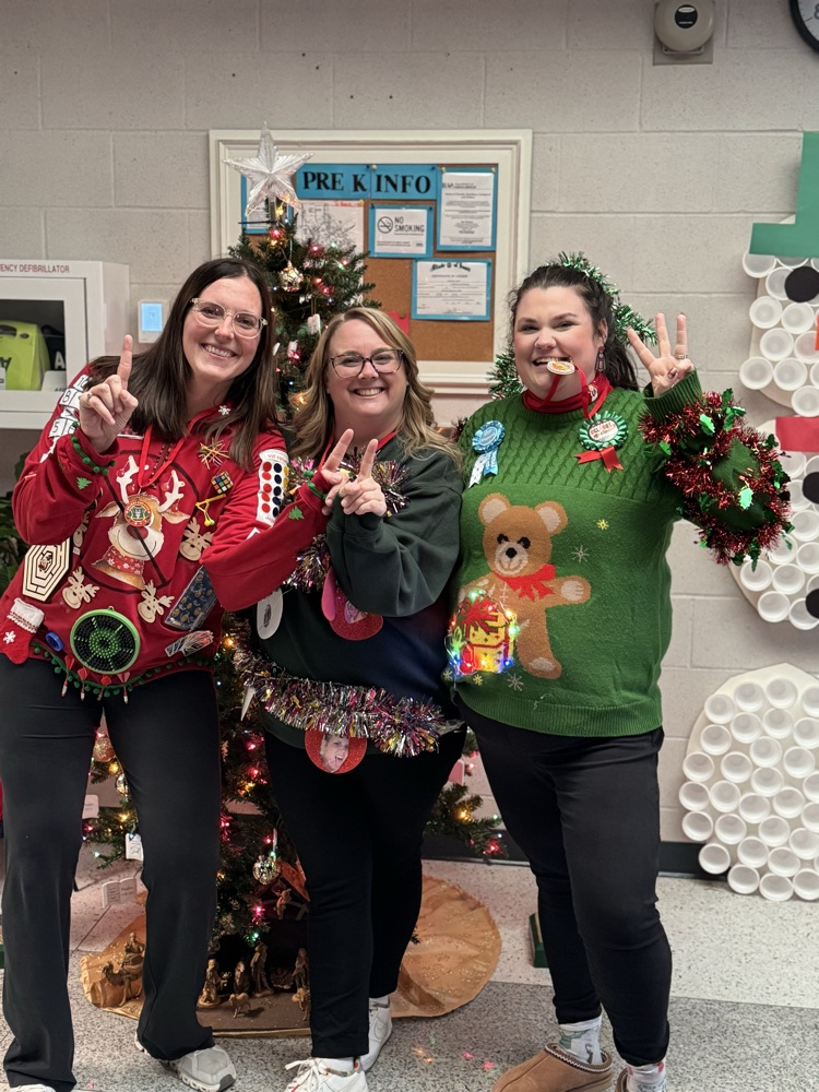 thee smiling ladies with ugly sweaters