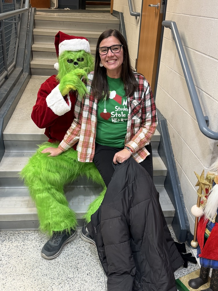 grinch and smiling lady 