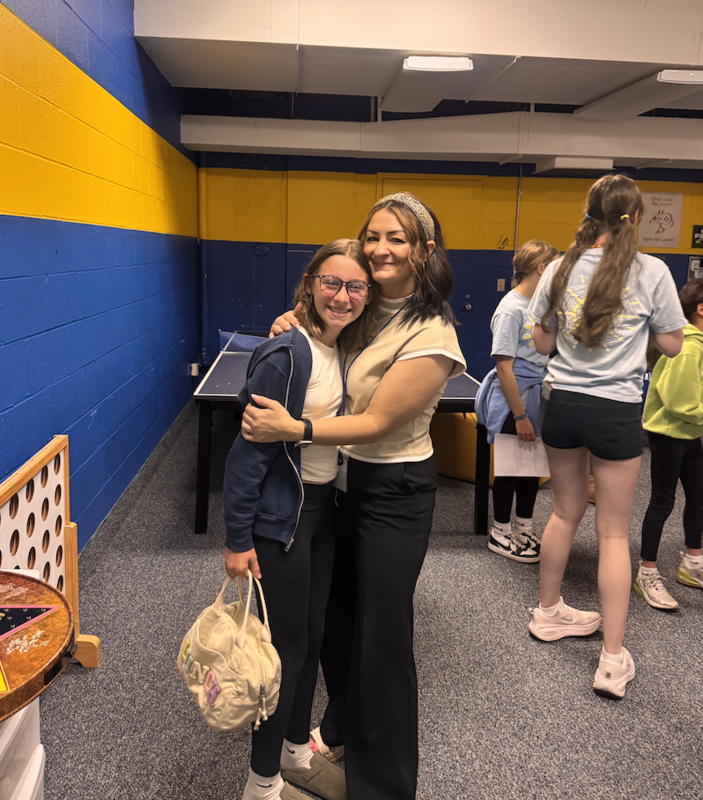 middle school students welcome primary school fourth graders for preview day