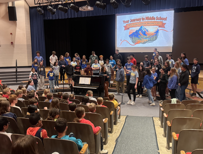middle school students welcome primary school fourth graders for preview day