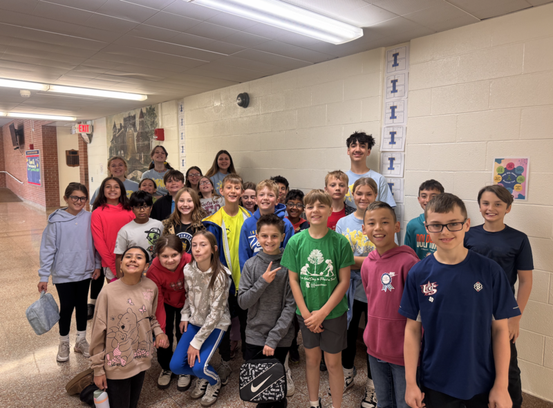 middle school students welcome primary school fourth graders for preview day