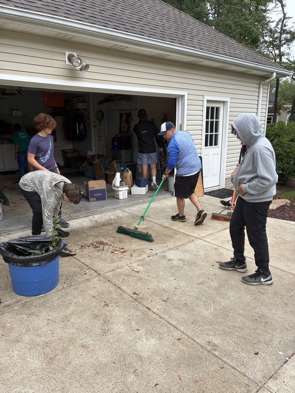 workers cleaning up yard