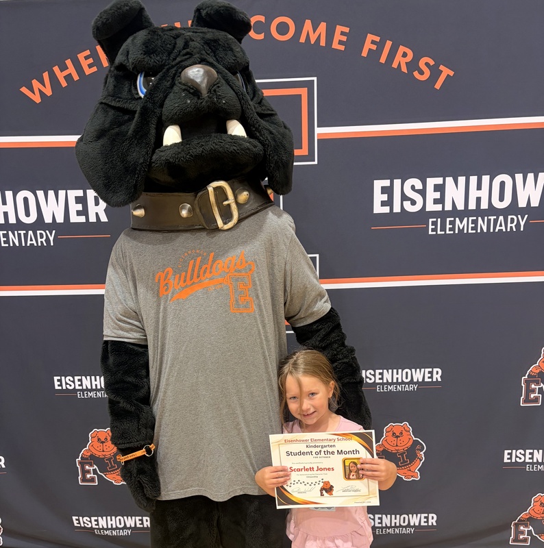 Students posing with mascot