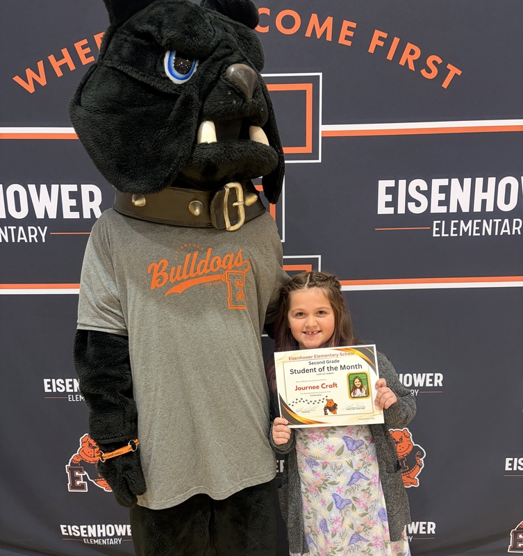 Students posing with mascot