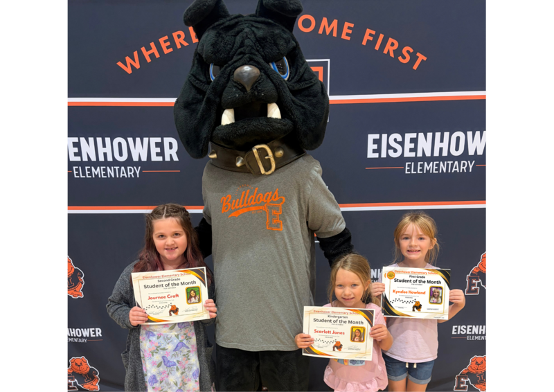 Students posing with mascot