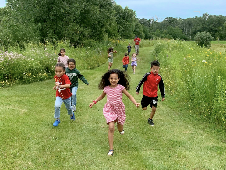 children running on grass