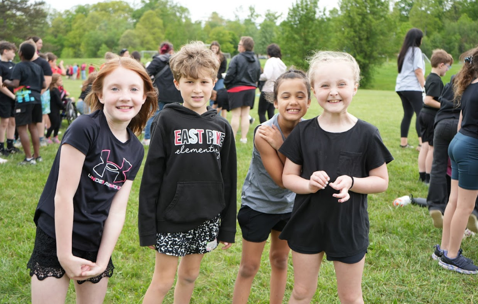 Students smiling for a photo at the Red and Black Games