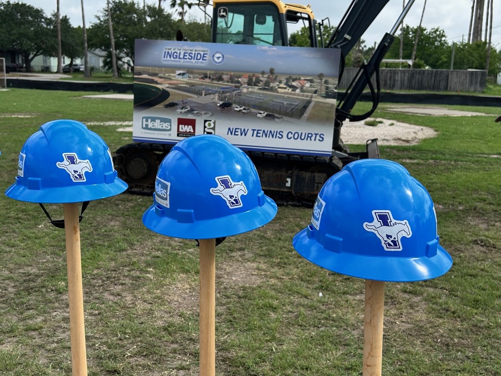Three blue hard hats on sticks, with an excavator and a sign reading "New Tennis Courts" in the background.