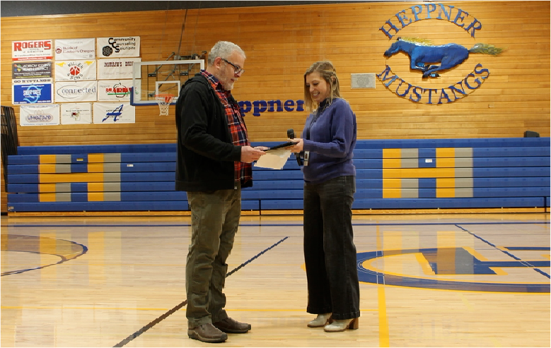 Dave Fowler receives award from Cailtin Russelll