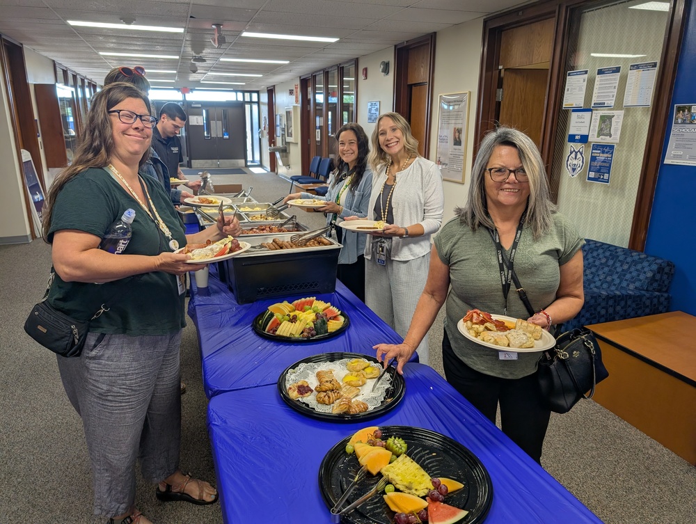 IMESD Employees serving breakfast