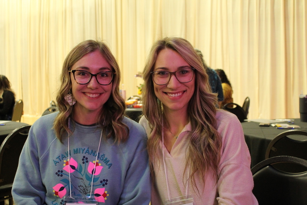 Two educators pose for a photo