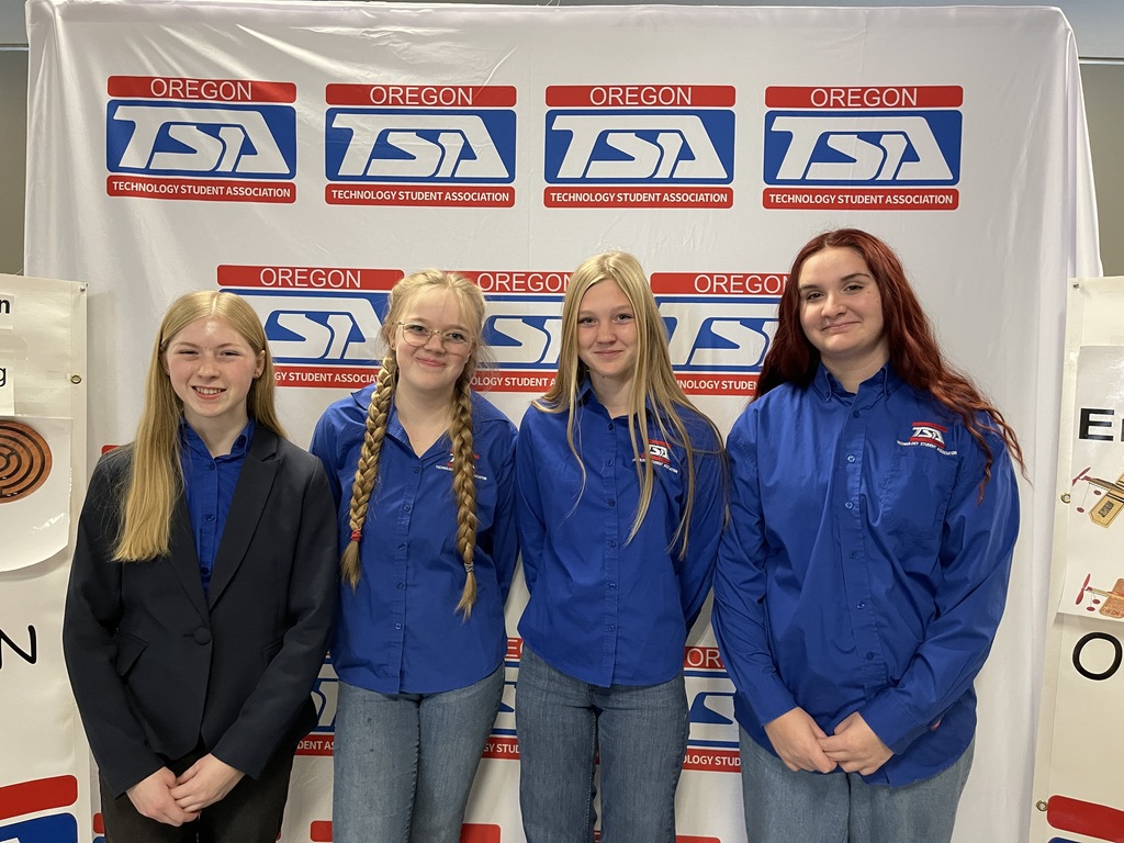 Oregon TSA members pose with Oregon TSA backdrop