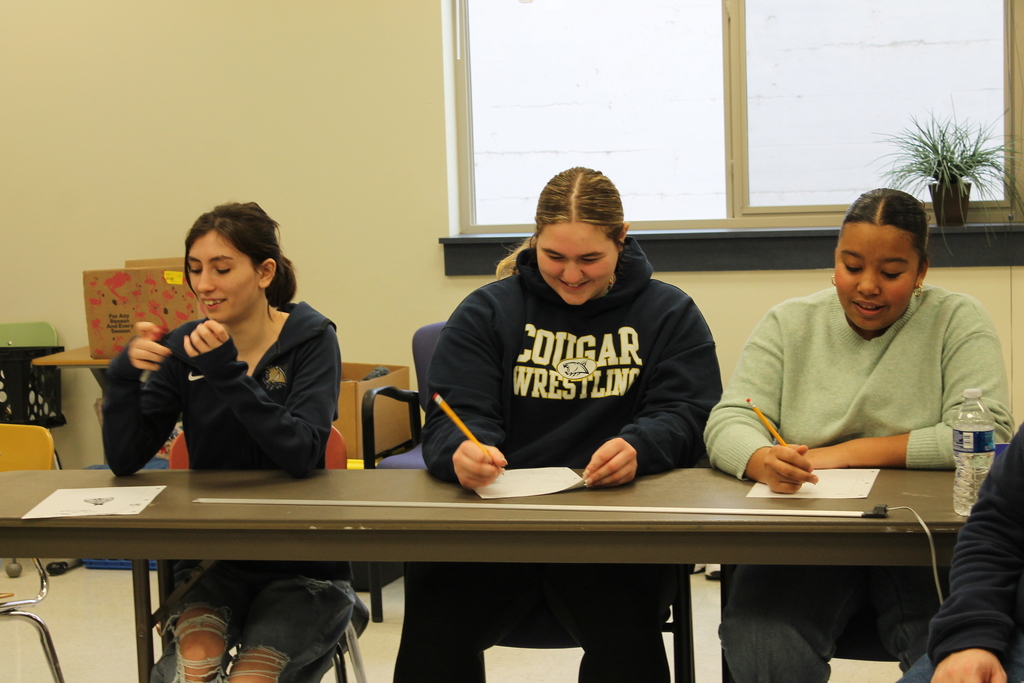 Participants solve a math problem