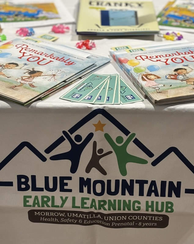 hub logo with books on table