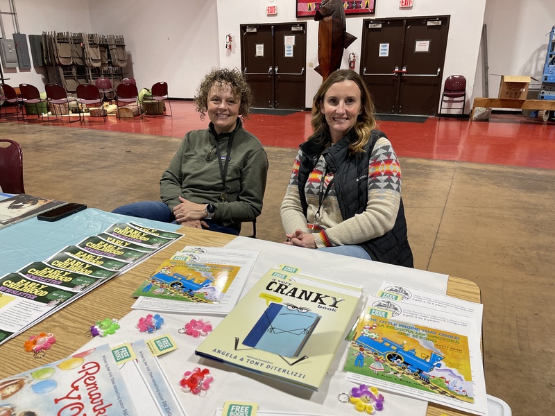 team at table with books