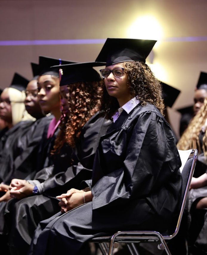 Graduates sit and wait their opportunity to cross the stage at our December commencement