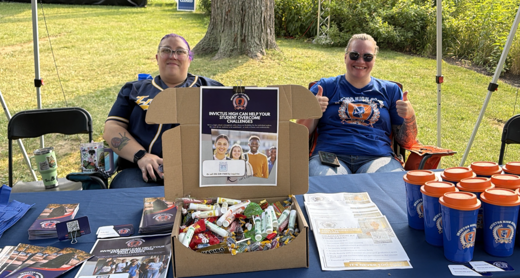 Two IHS Employees at a promotion table