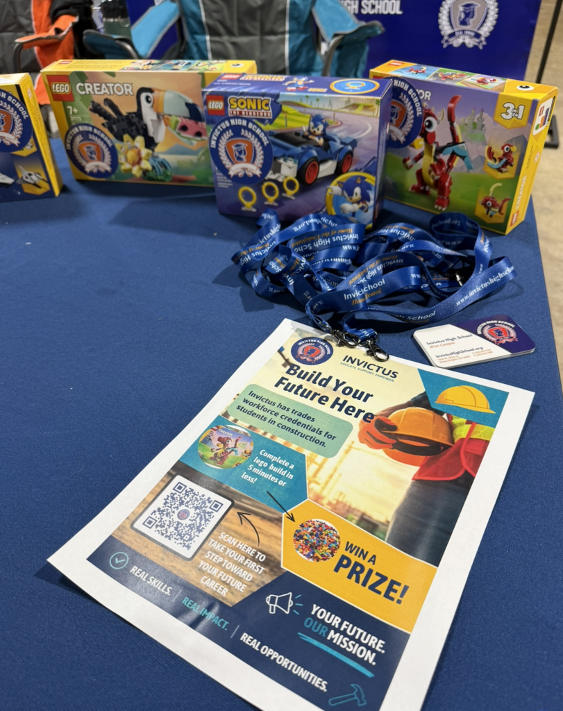 A table with lego kits and a flyer for our CTE challenge.