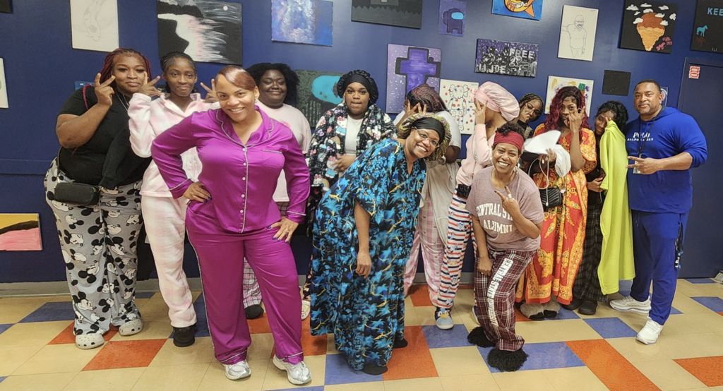 A group of East campus undefeated show off their pajamas in the cafeteria.