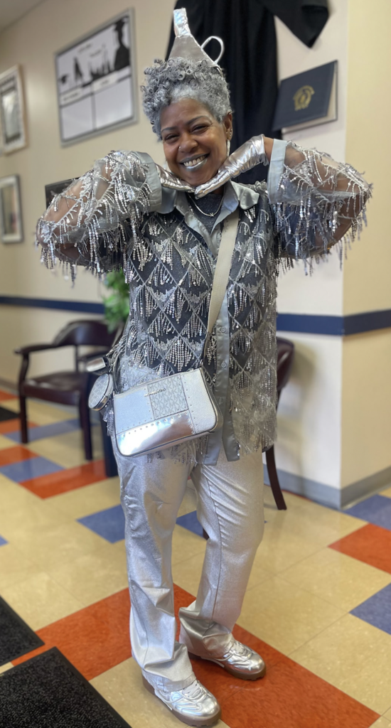 Ms. Berry smiling for the camera in her tin man costume.