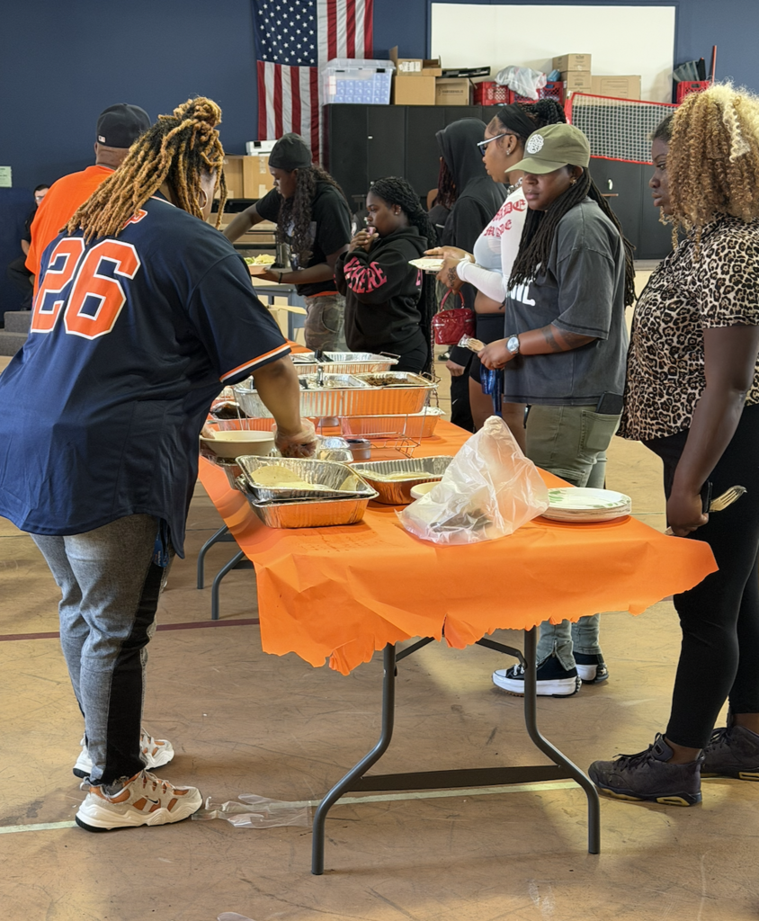 Students at a table getting food.