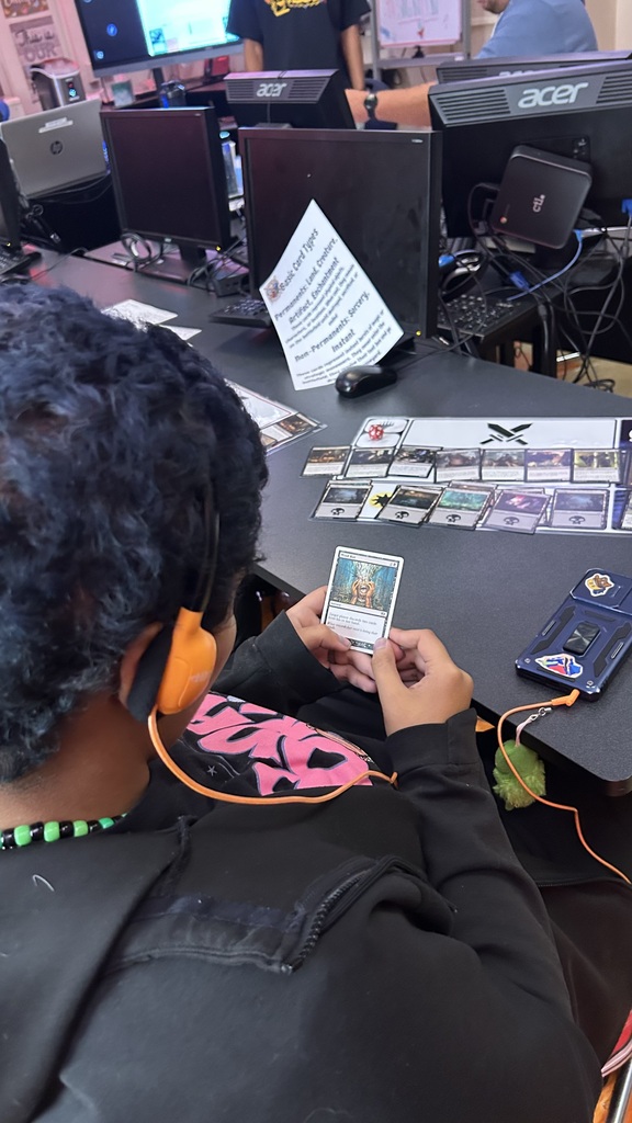 A photo over student shoulder of their card layout.