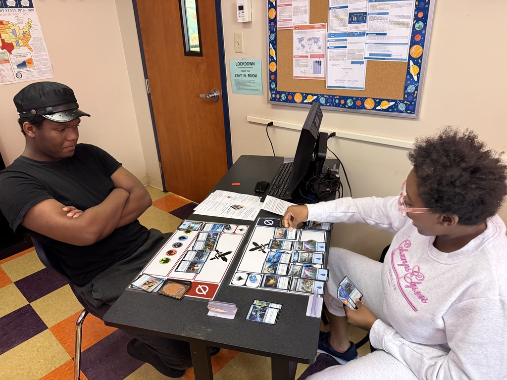 Students play a round of Magic
