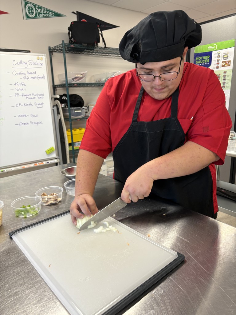 culinary student demonstrating knife cuts