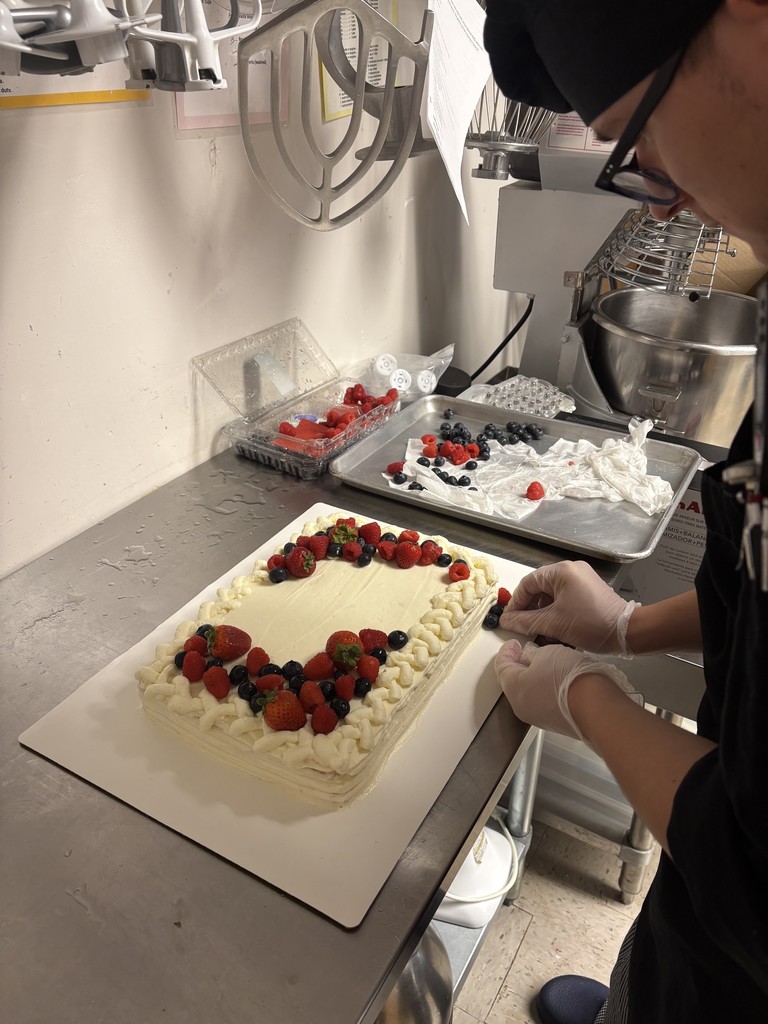 Student decorating cake