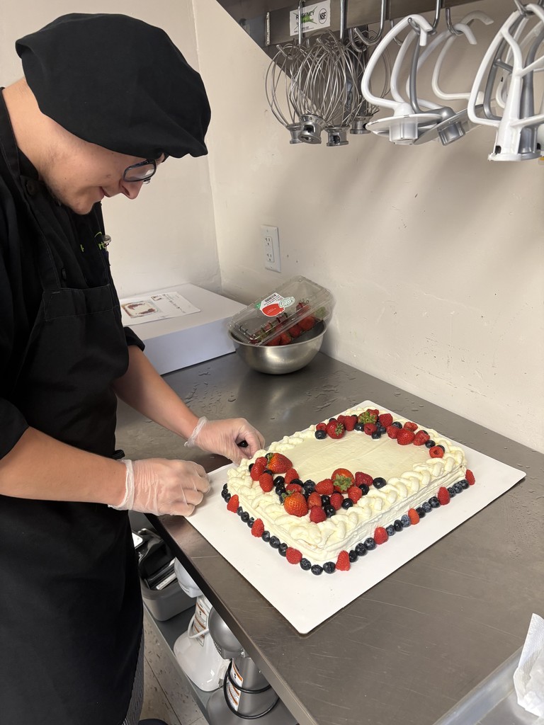 Student decorating cake