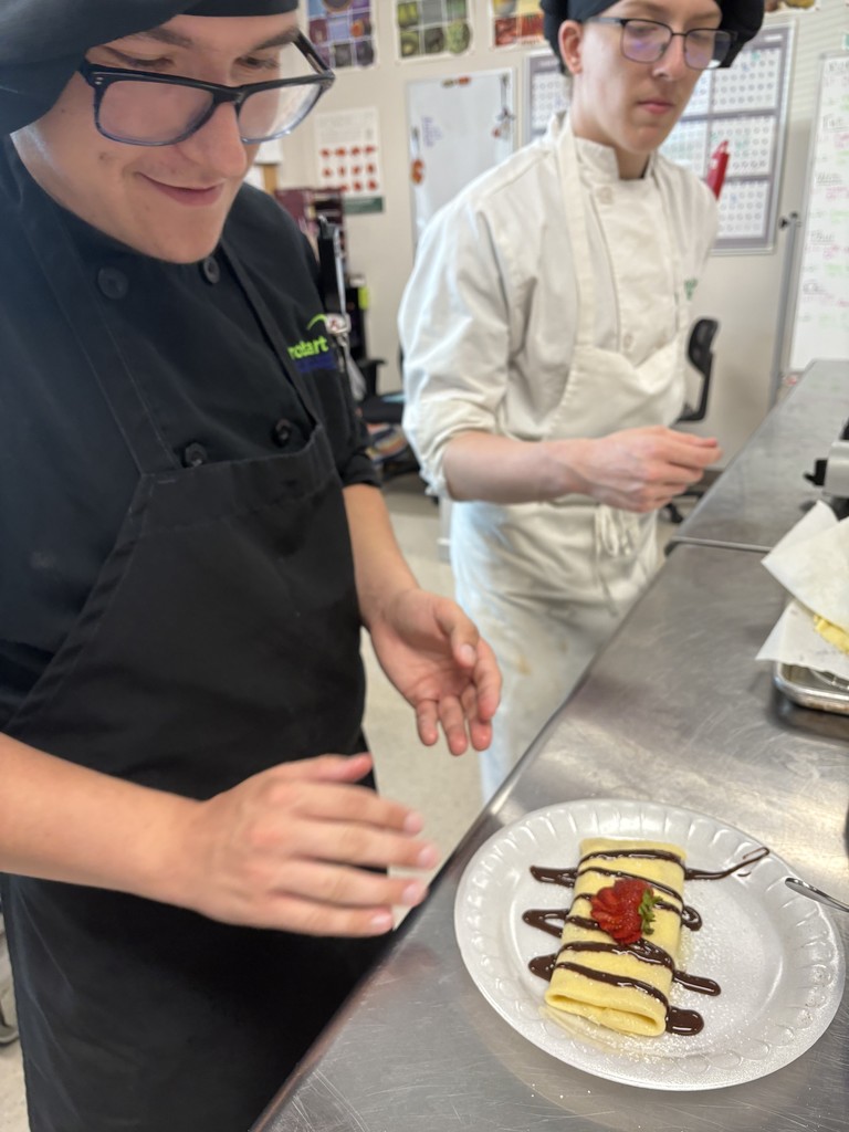students working on dessert plating