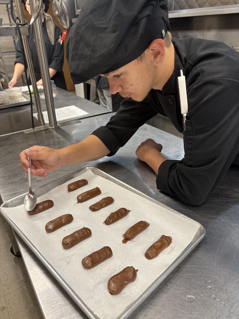 student working on dessert plating