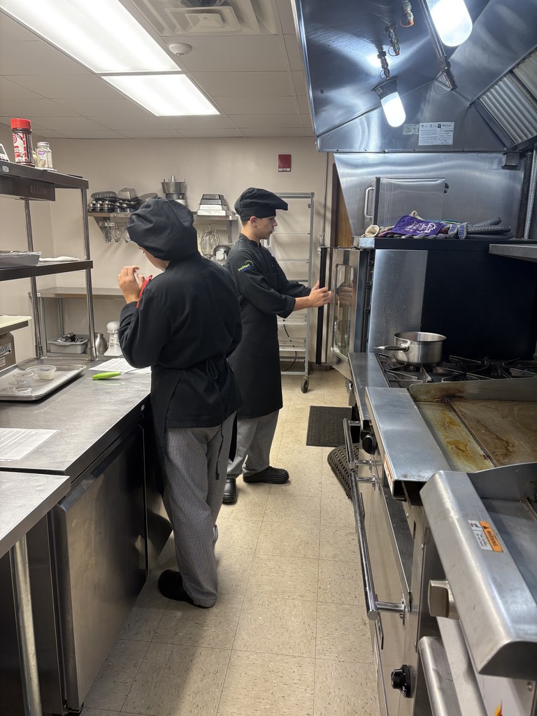 student working on dessert plating