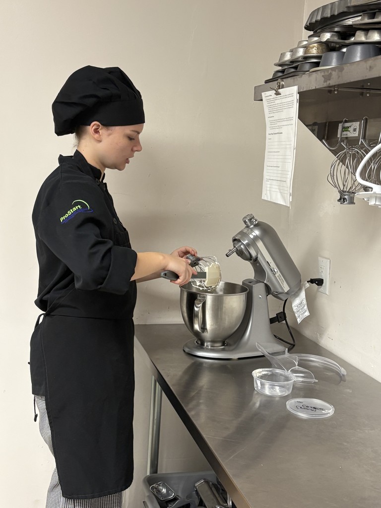 student working on dessert plating