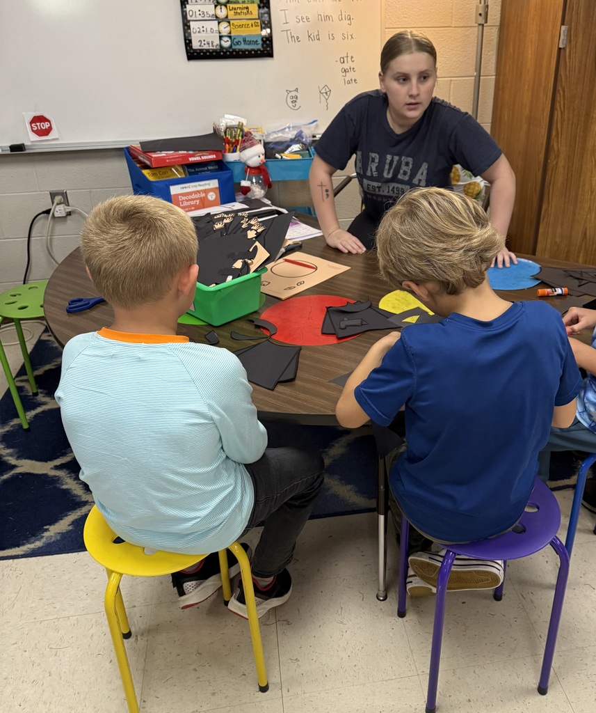 Student Cadet helping students