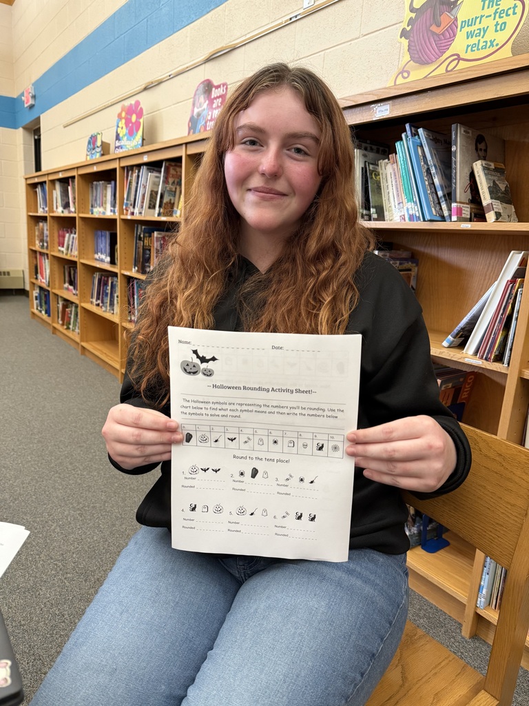 Student with Halloween Match Worksheet