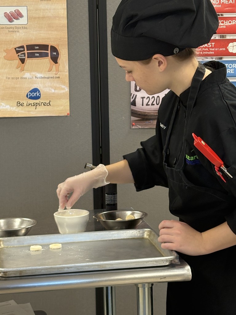 Culinary student working on plating