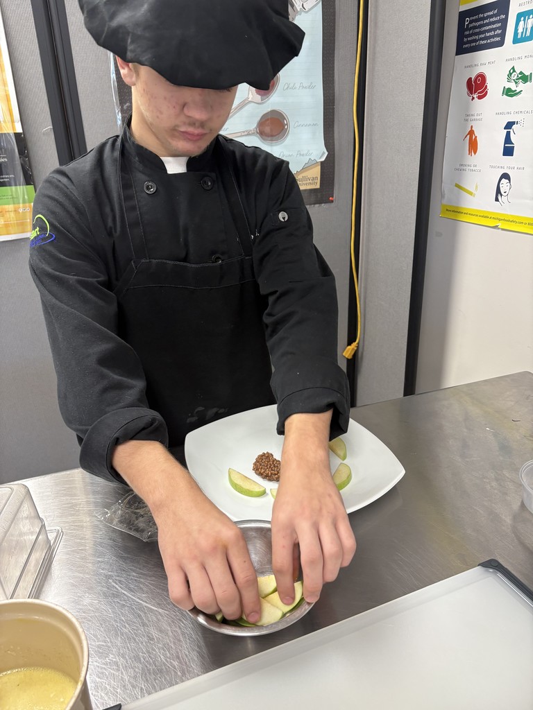 Culinary student working on plating
