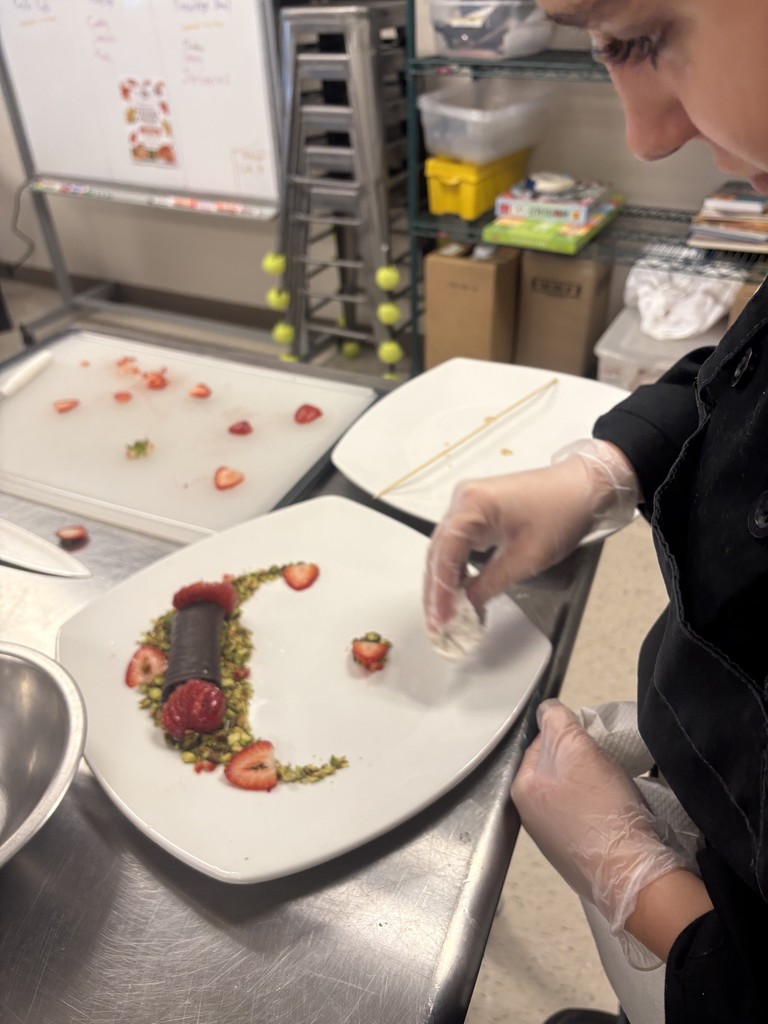 Culinary student working on plating