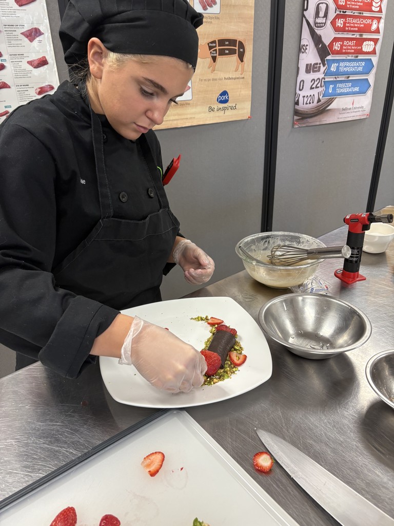 Culinary student working on plating