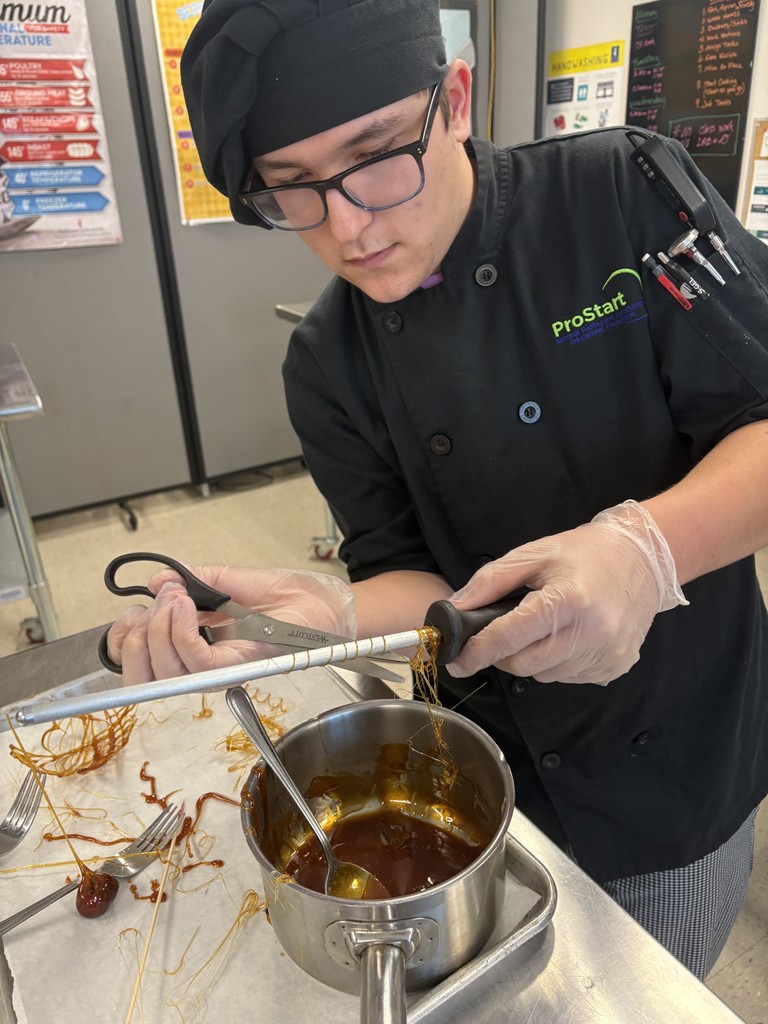 student with a pot of carmel