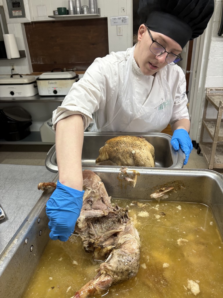 student preparing turkey