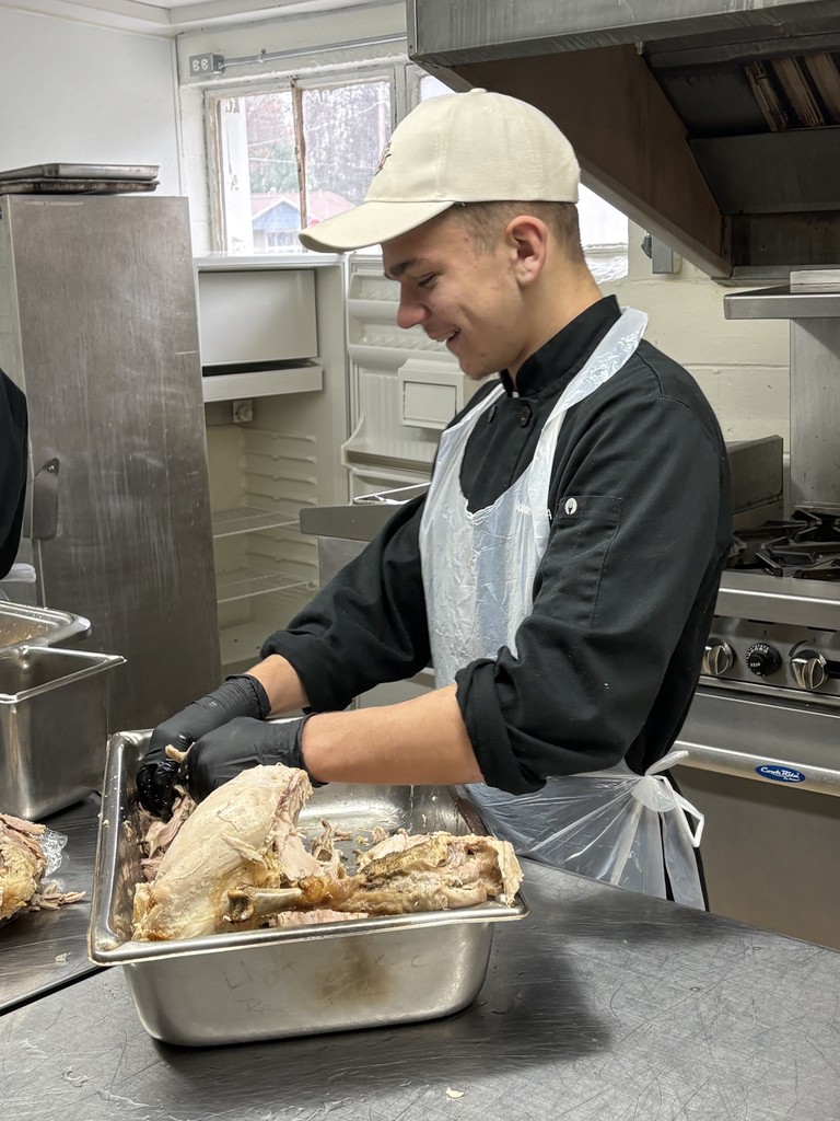 student preparing turkey