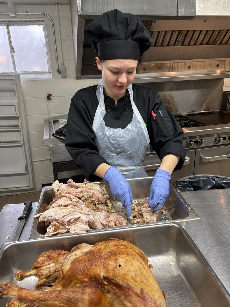 student preparing turkey