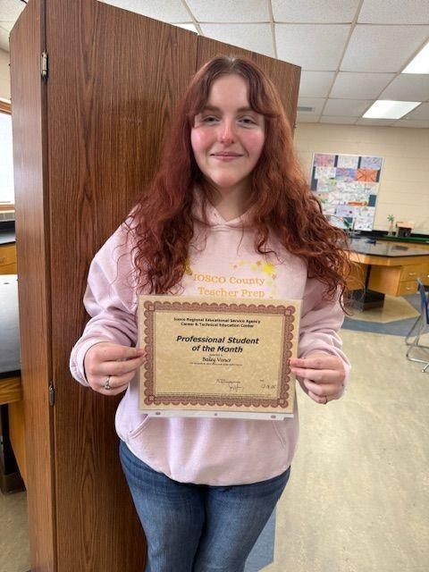 Girl holding a certificate